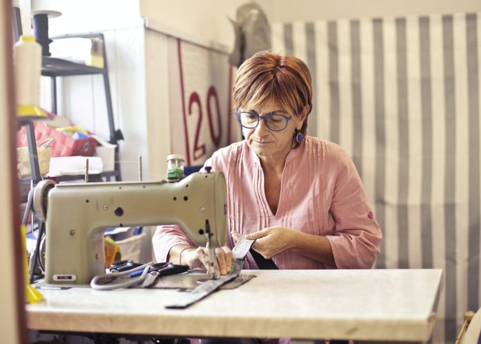 seamstress behind a sewing machine